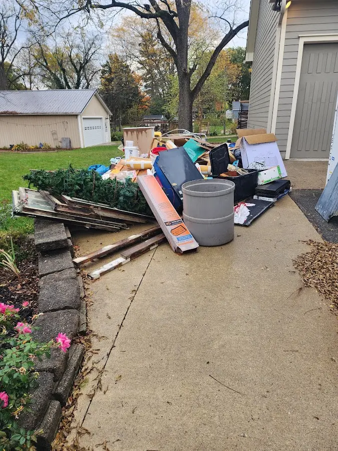 Dumpster being loaded with debris for 10 Yard Dumpster Rental in Pittston